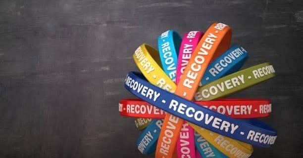 Colorful wristbands printed with the word recovery